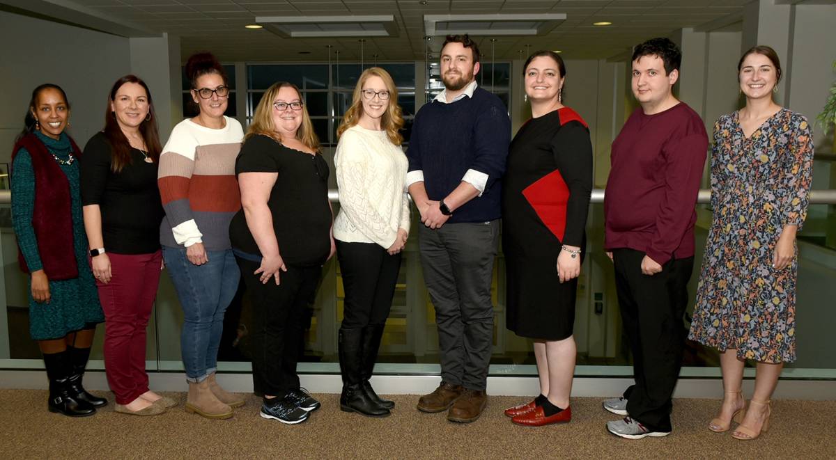 Fall 2022 Spire inductees From left: Spire Advisors Monica Brown-Hodkinson and Jenny Lewis; Spire inductees Kim Clark, April Holeck, Laura Malagese, John Bessette, Tzina Klein, and Matthew Thomas; Spire Advisor Samantha Johnston