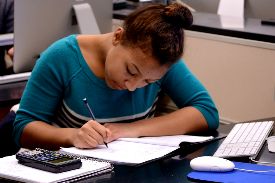 Student taking notes in class