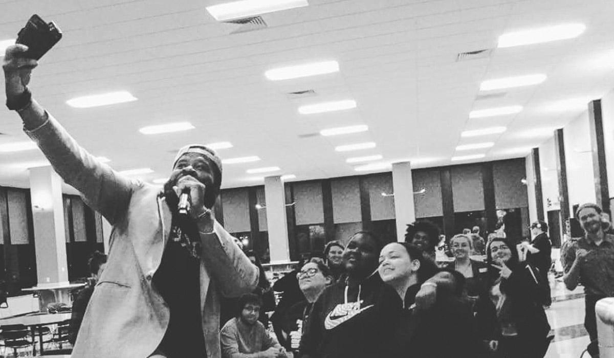 Program Board Comedian taking a selfie with MVCC Students