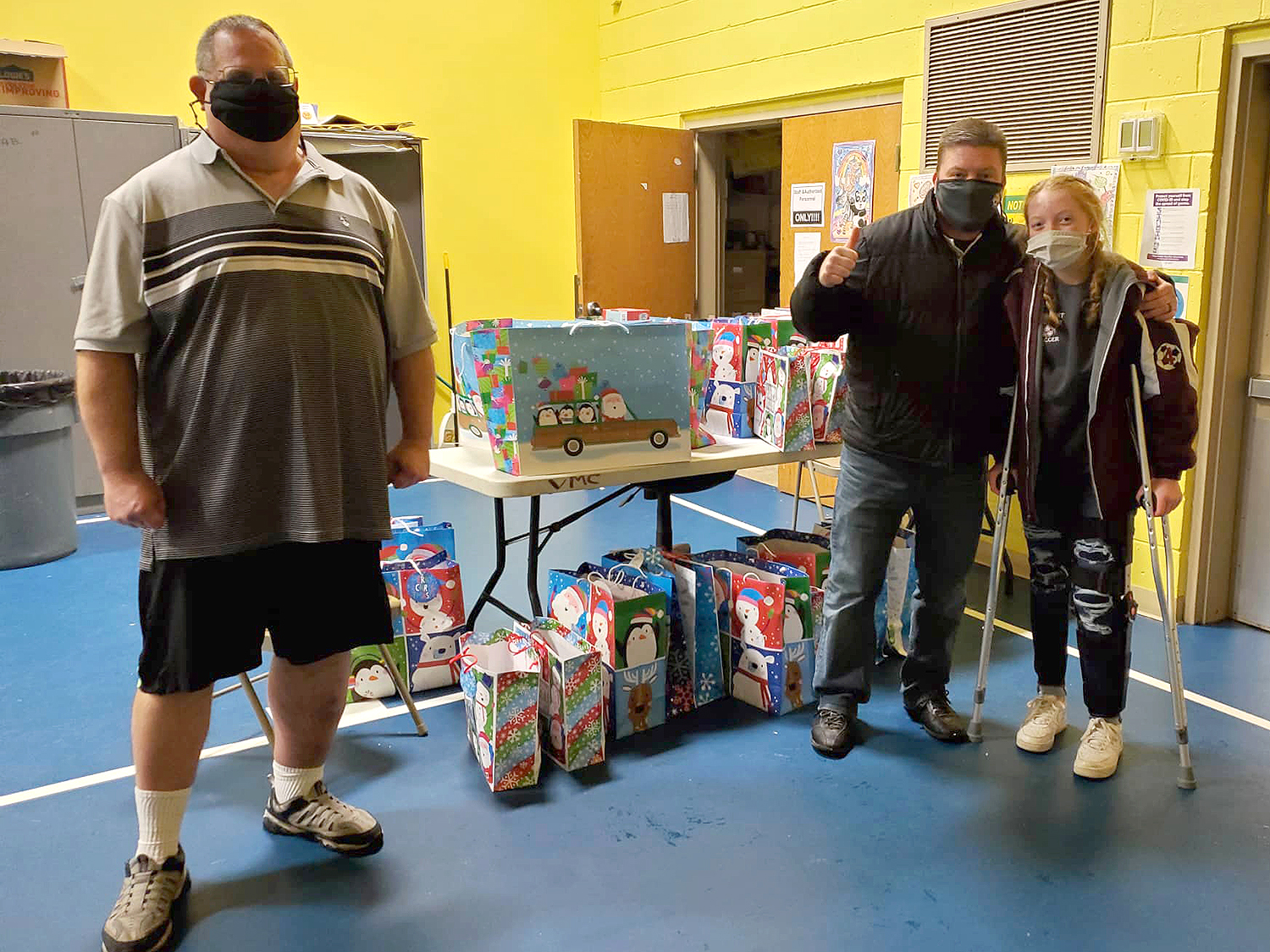 Kidz N Coaches delivered the wrapped gifts to the apartment building where the children live.