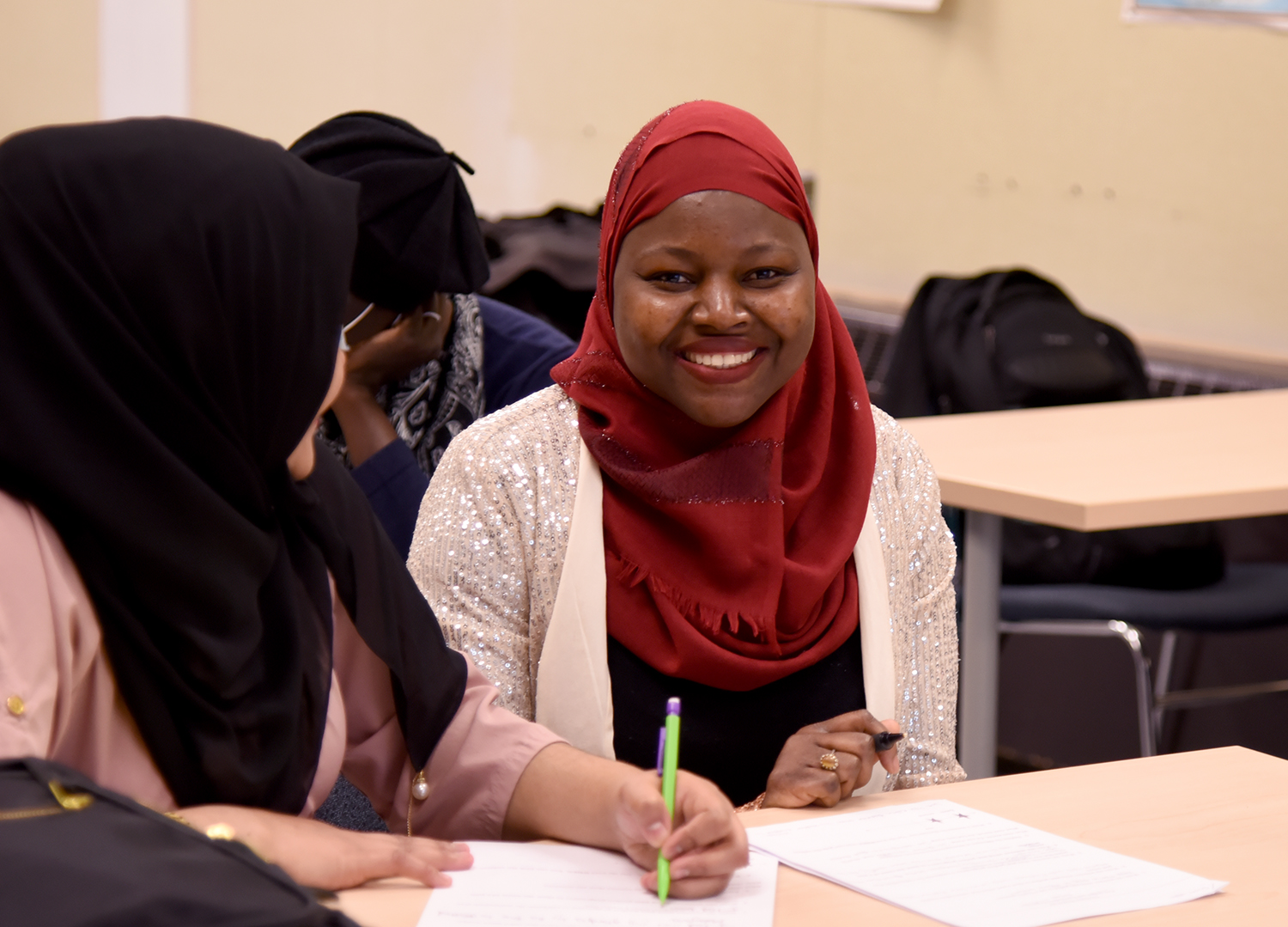 A smiling student in the liberal arts and sciences program