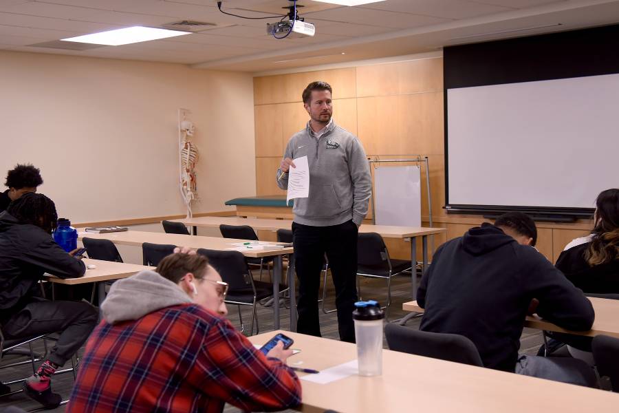 Professor Matt St Croix lecturing in classroom
