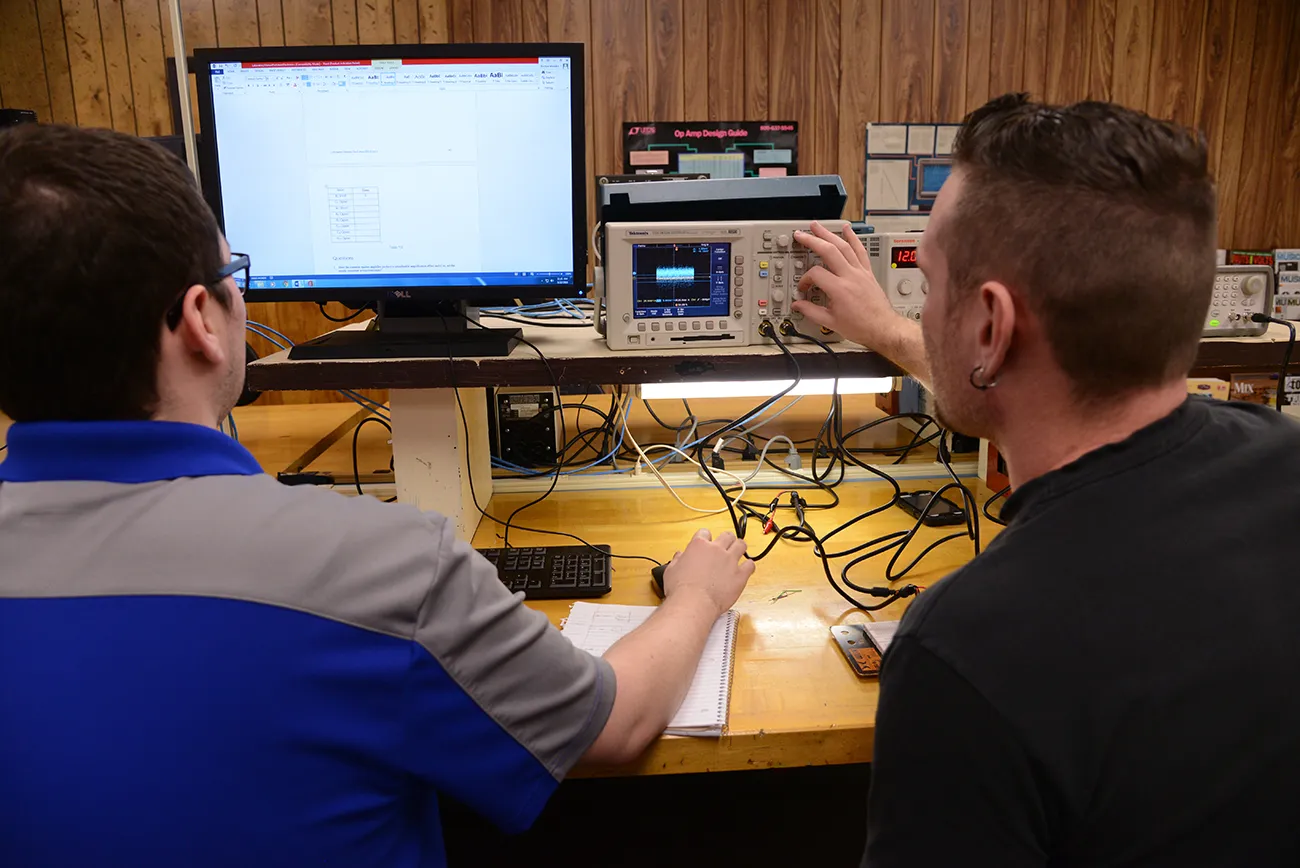 Electric Service Technician students in the electrical lab