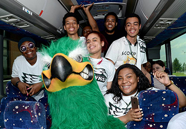 Students on bus with Mo Hawk