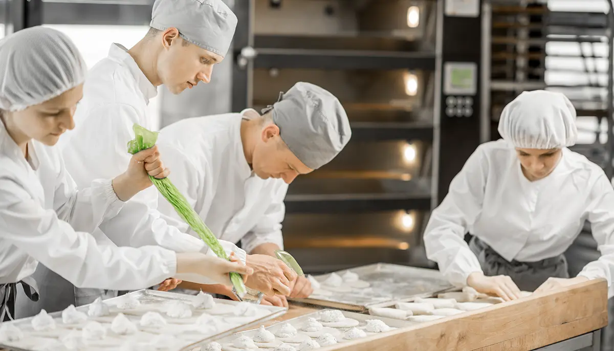 Chefs producing pastry at a profession bakery