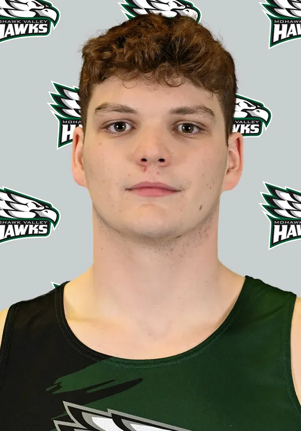 Image of person in front of white and green backdrop