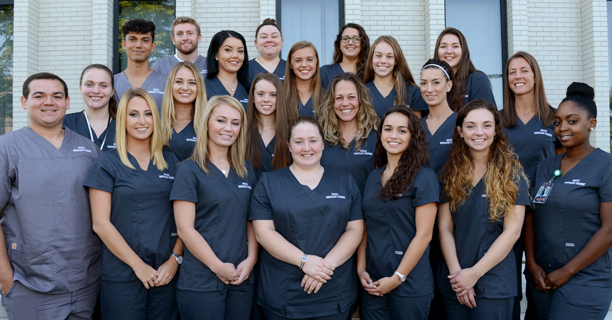 Group of Radiologic Technology students standing together outside in scrubs