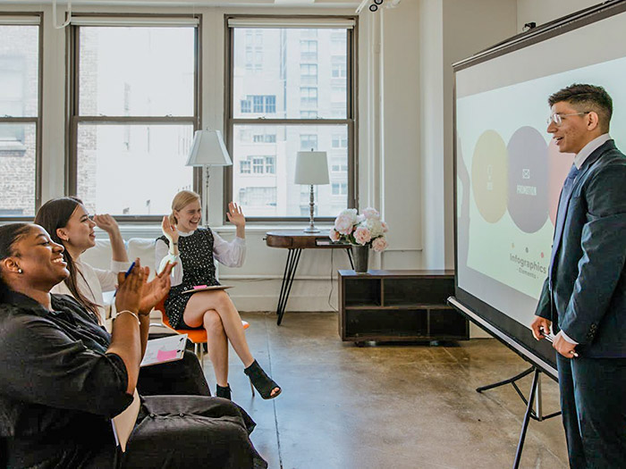 image of teacher in front of class giving presentation